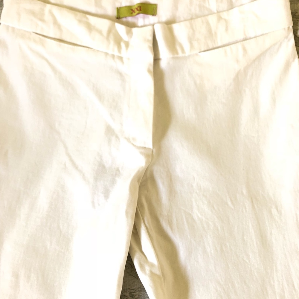 Boot cut white pants.